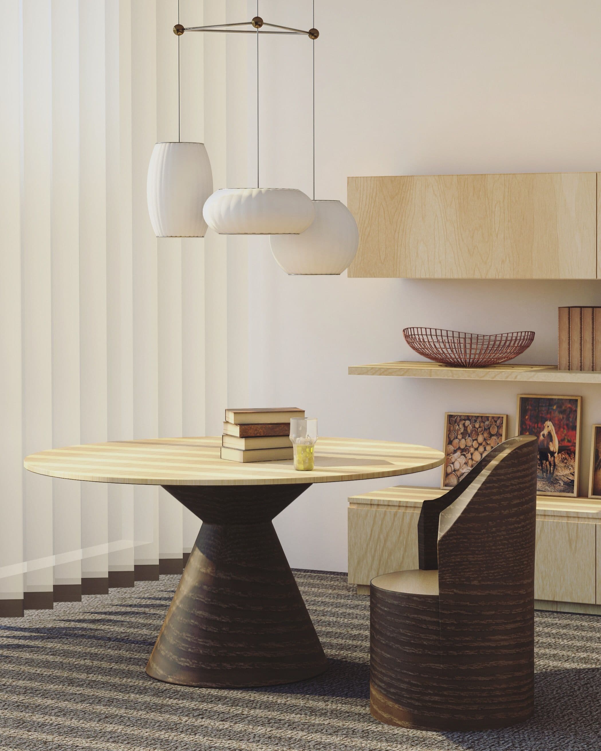 Stack of books on a round wood table in a modern sunlit interior