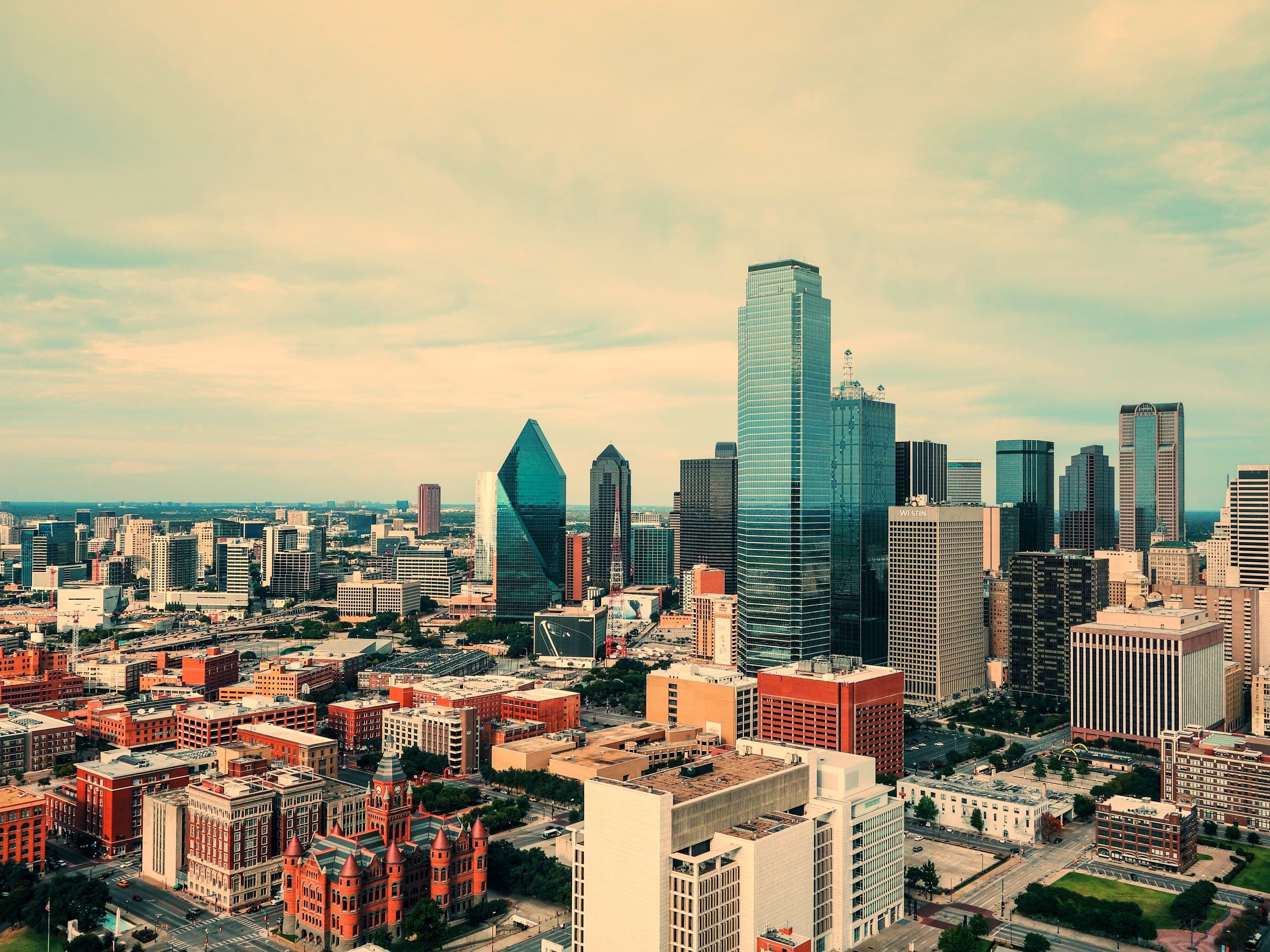 Downtown Dallas at late afternoon, looking across the Old Red Courthouse toward Fountain Place and Bank of America Plaza